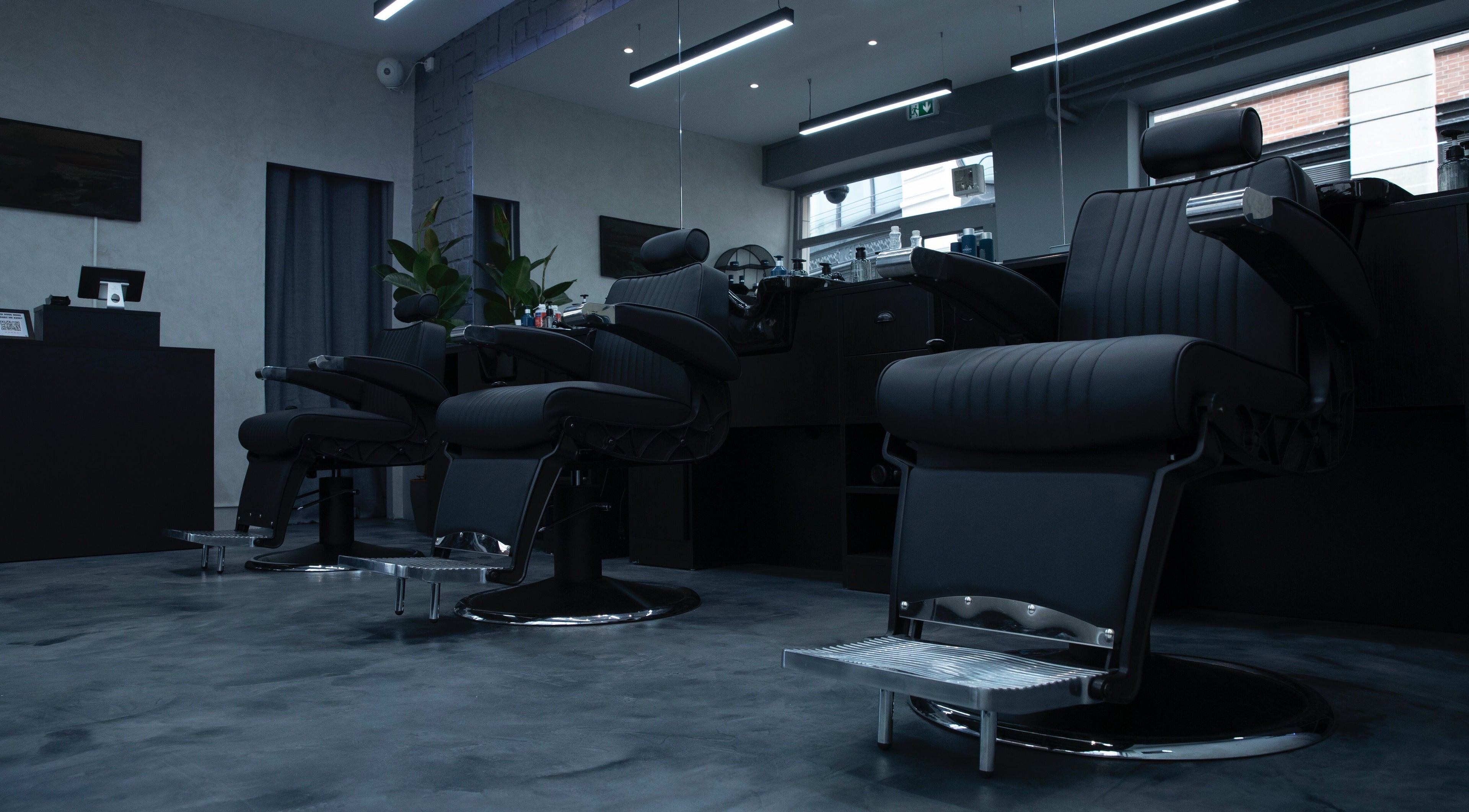 Modern barber chairs at Yanis - NEAT, Paris, Île-de-france, FR, showcasing sleek style and comfort.