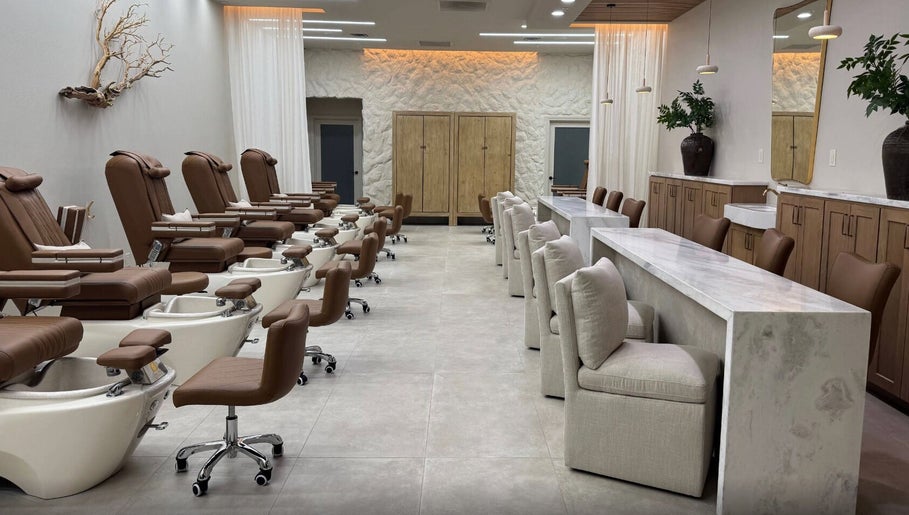 Chic interior of Zodiac Nail Boutique, Santa Clarita, CA, US, featuring plush chairs and modern decor.