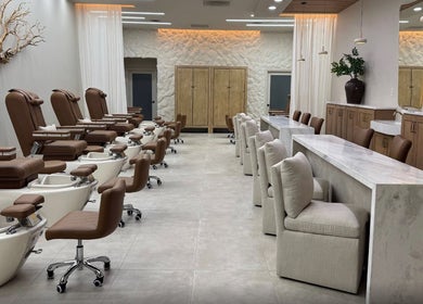 Chic interior of Zodiac Nail Boutique, Santa Clarita, CA, US, featuring plush chairs and modern decor.