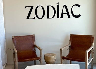 Stylish leather chairs and signage at Zodiac Nail Boutique in Santa Clarita, CA, US, offering a welcoming ambiance.