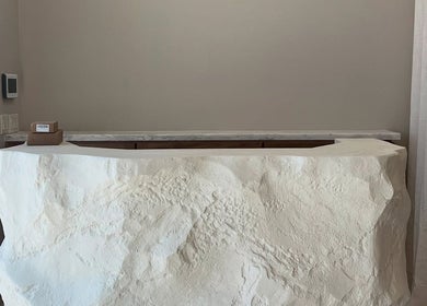 Elegant stone reception desk at Zodiac Nail Boutique in Santa Clarita, CA, US.