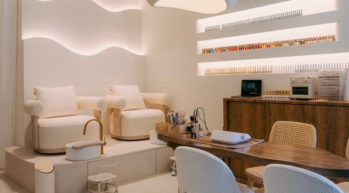 Elegant spa interior at DEP HOUSE, Singapore, SG with plush chairs and beauty treatment tools.