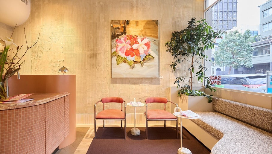 Relaxing seating area at Sage Space, Darlinghurst, New South Wales, AU, with floral decor and natural light.