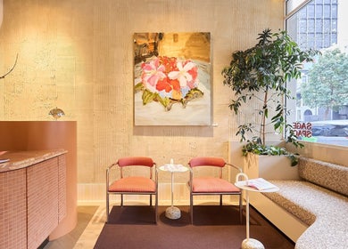 Relaxing seating area at Sage Space, Darlinghurst, New South Wales, AU, with floral decor and natural light.