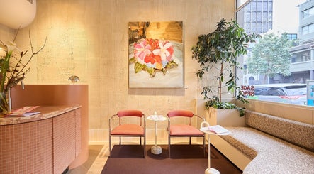 Relaxing seating area at Sage Space, Darlinghurst, New South Wales, AU, with floral decor and natural light.