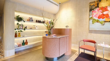 Chic reception at Sage Space, Darlinghurst NSW, featuring modern decor and floral art.