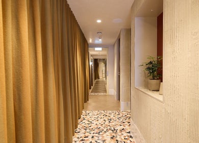 Elegant hallway at Sage Space in Darlinghurst, New South Wales, AU, featuring earthy tones and modern decor.