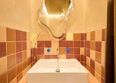 Elegant artistic mirror and modern sink at Sage Space, Darlinghurst, New South Wales, AU.