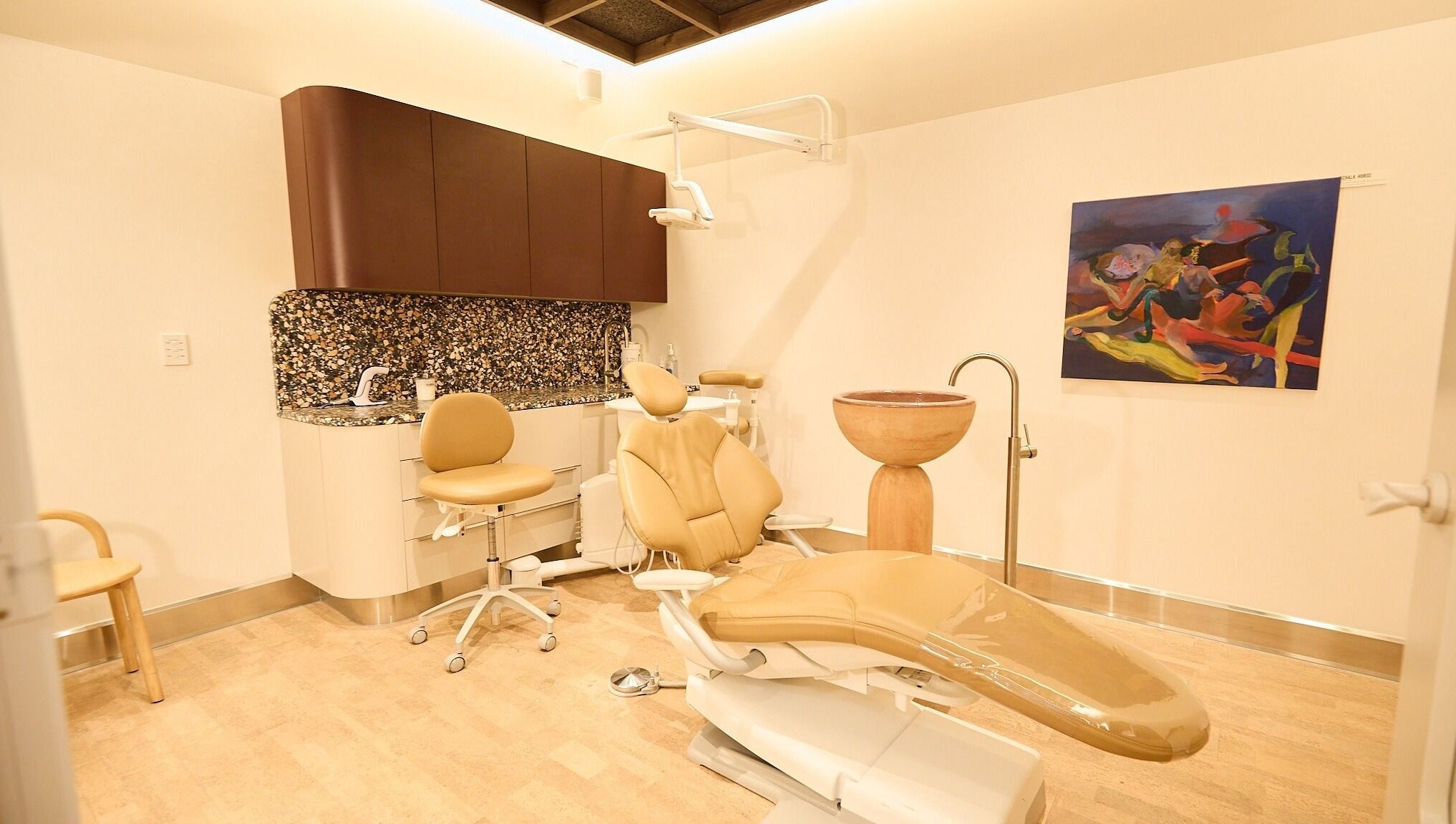 Chic dental suite at Sage Space, Darlinghurst, New South Wales, AU featuring modern chairs and colorful art.