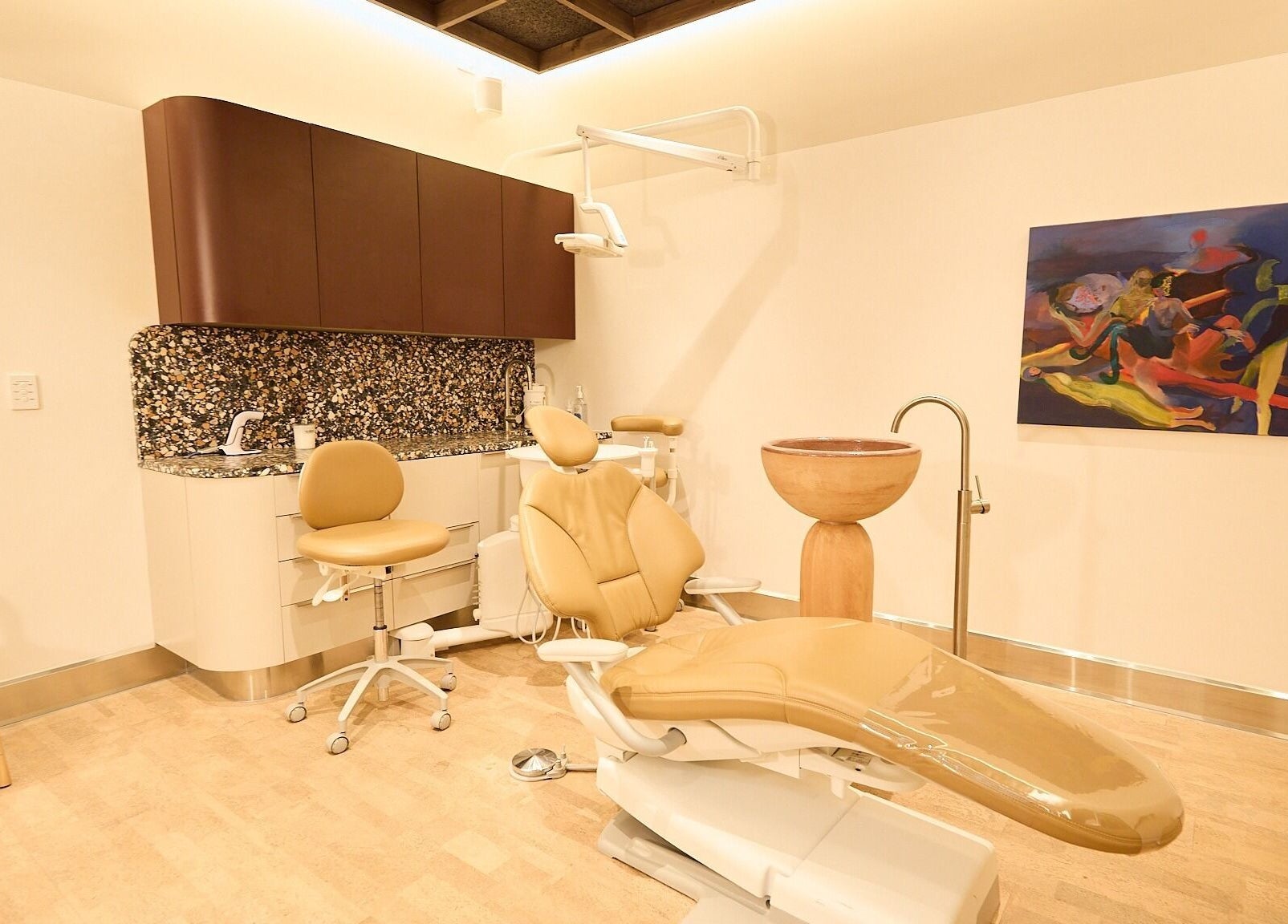 Chic dental suite at Sage Space, Darlinghurst, New South Wales, AU featuring modern chairs and colorful art.
