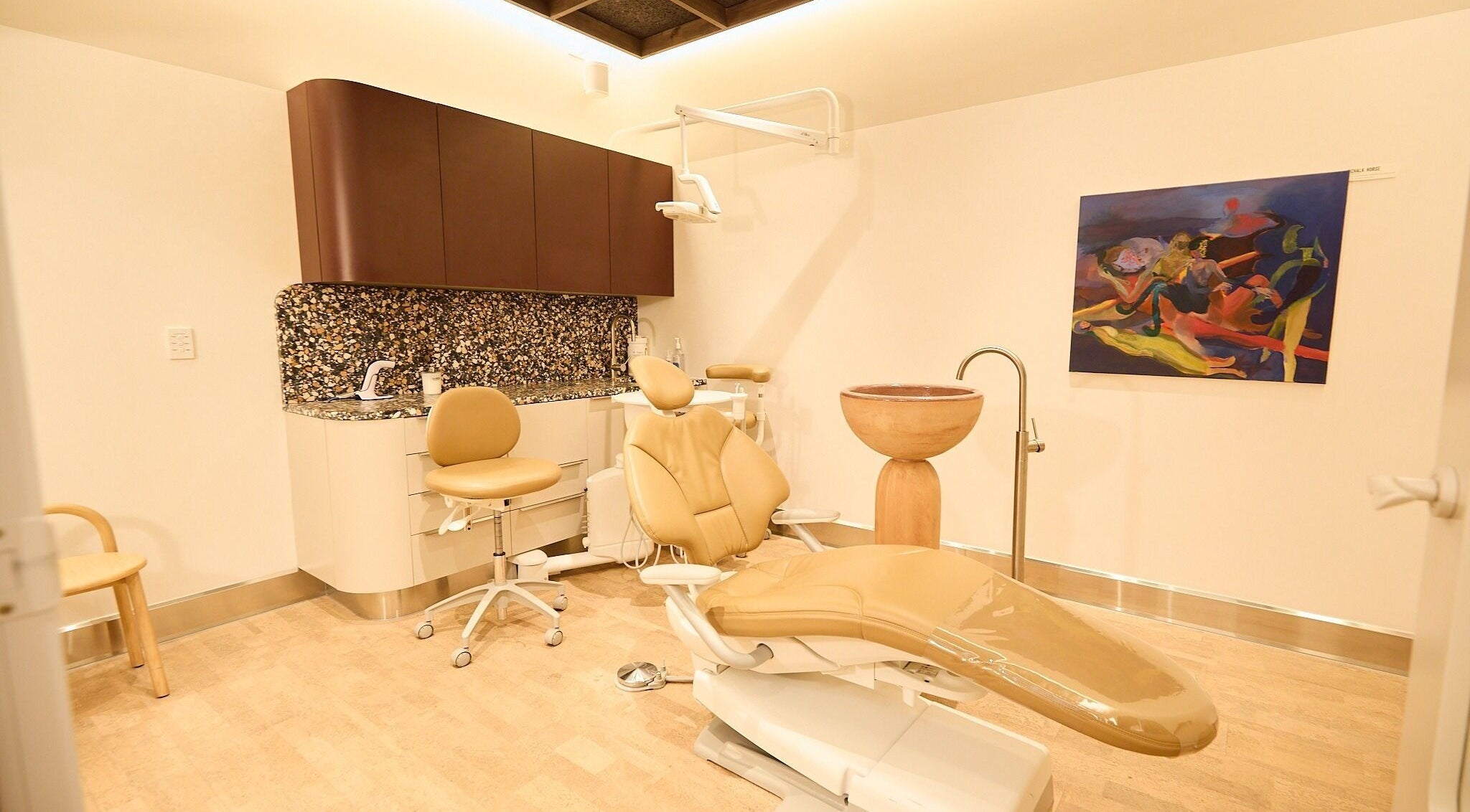 Chic dental suite at Sage Space, Darlinghurst, New South Wales, AU featuring modern chairs and colorful art.