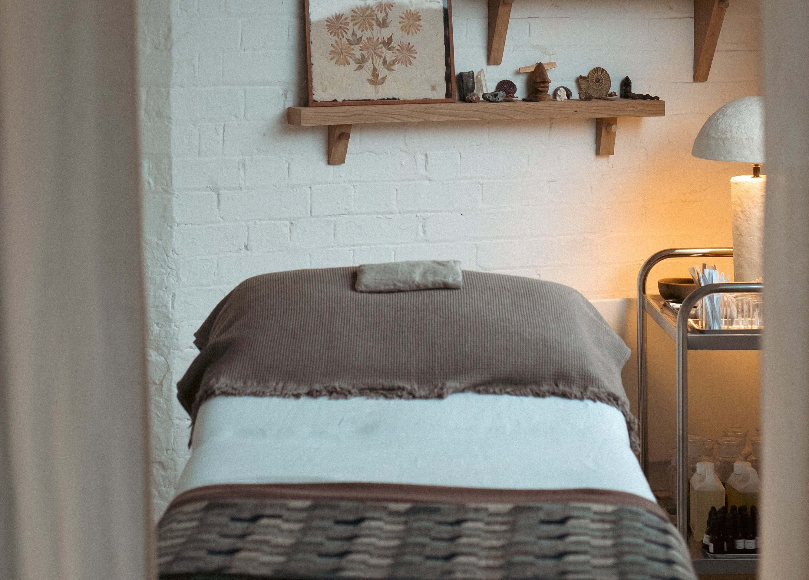 Massage bed in calming room at In Our Neighbourhood Apothecary, London, England, GB.