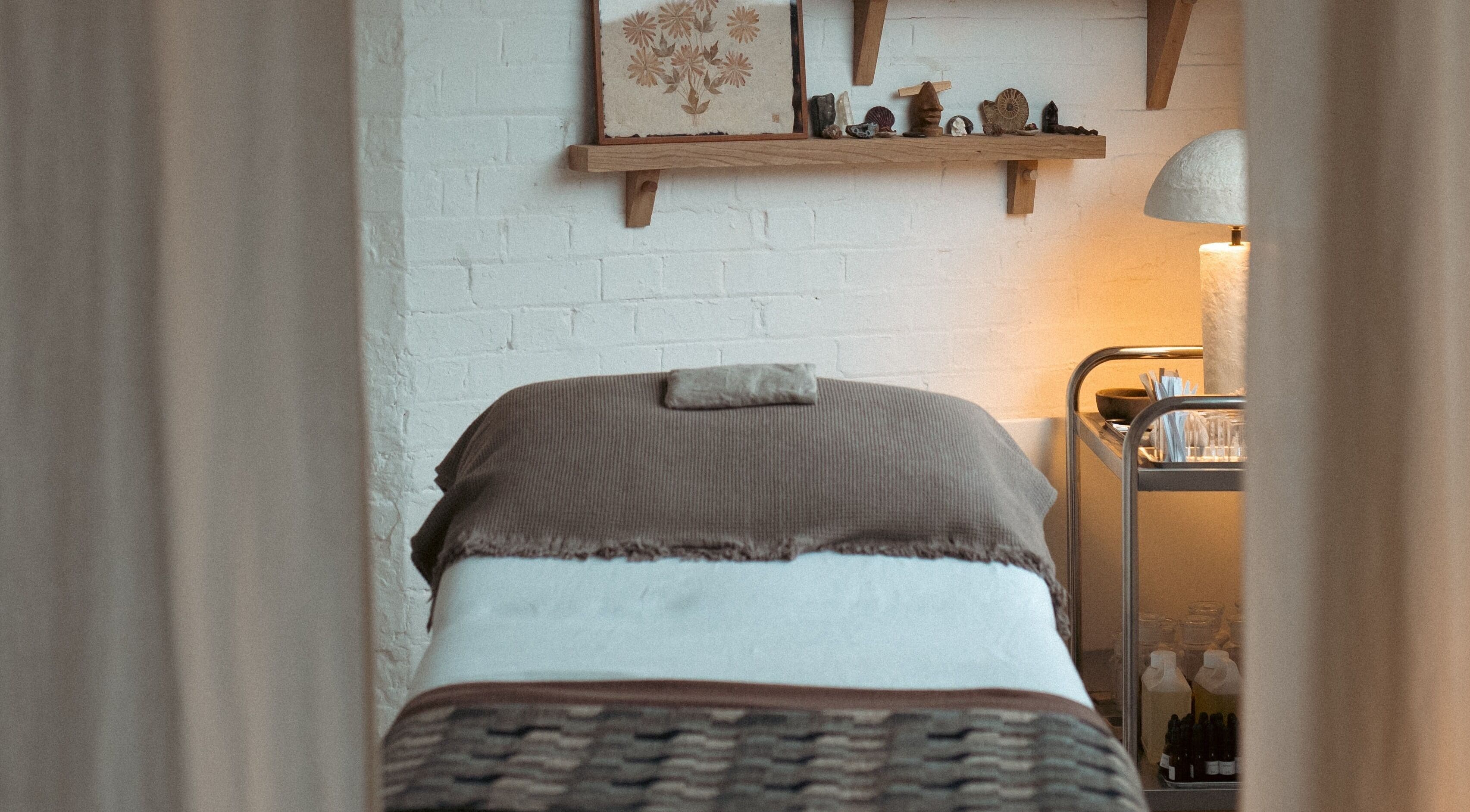 Massage bed in calming room at In Our Neighbourhood Apothecary, London, England, GB.
