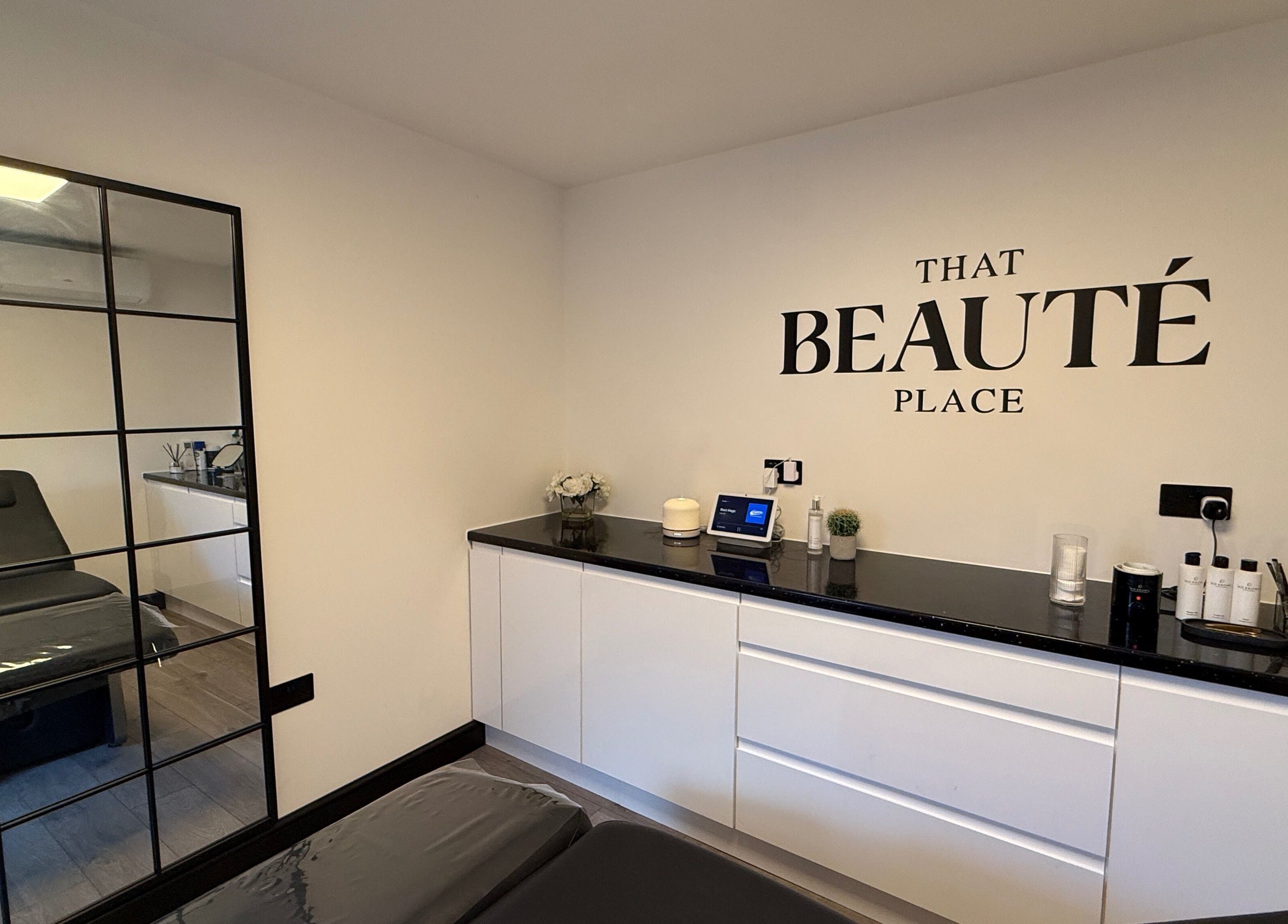 Elegantly designed room at That Beaute Place, Alconbury, England. Includes sleek furniture and modern decor.