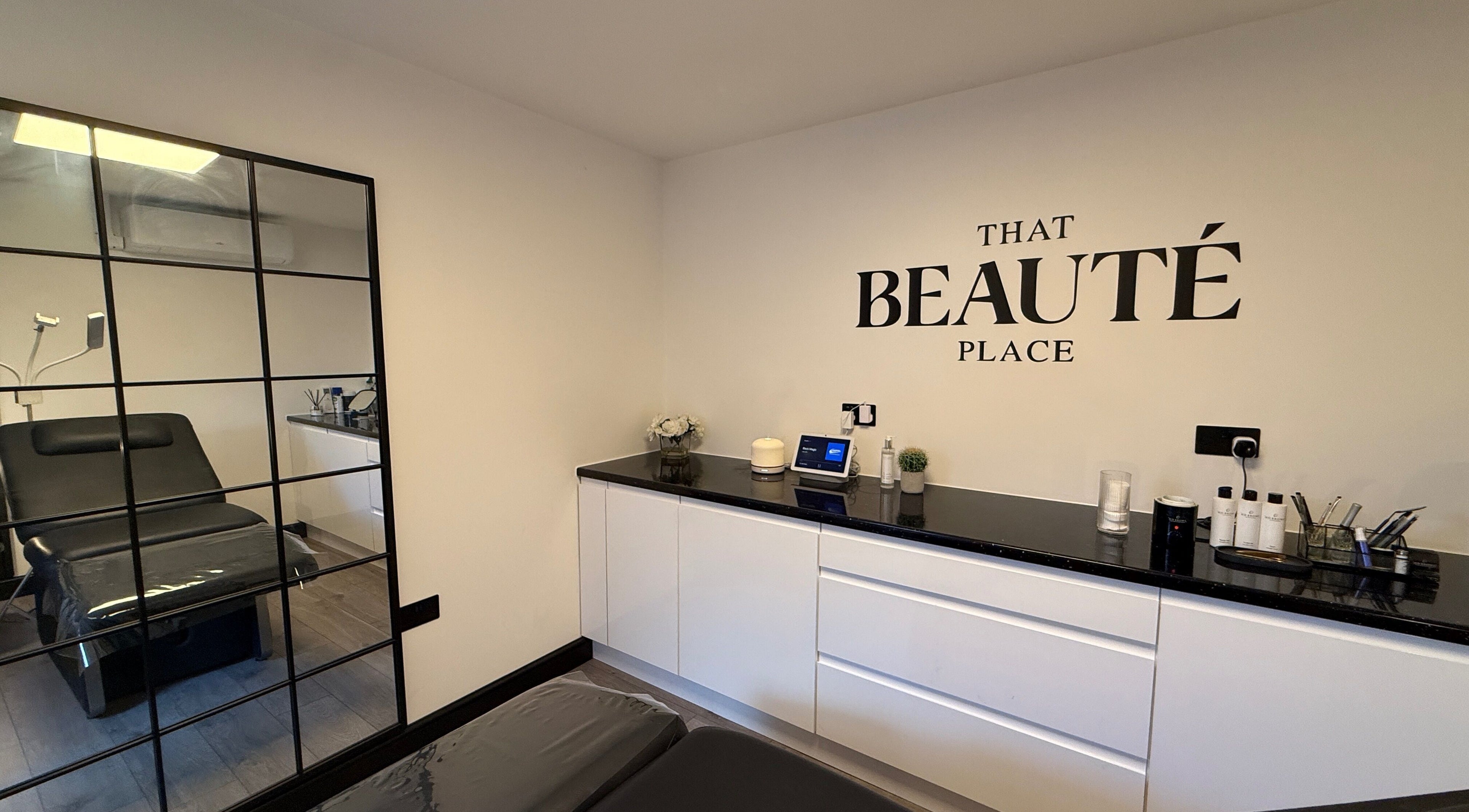 Elegantly designed room at That Beaute Place, Alconbury, England. Includes sleek furniture and modern decor.