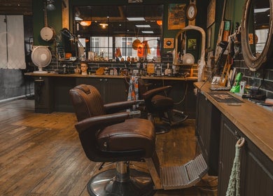 Charming interior of Lost & Found, Sheffield, England, GB, featuring vintage barber chairs and a cozy atmosphere.