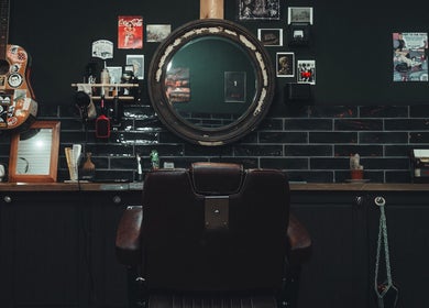 Cozy vintage barber setup at Lost & Found, Sheffield, England, GB showcasing unique decor and styling chair.
