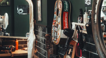 Stylish salon corner at Lost & Found, Sheffield, England, GB, with guitar decor and hair styling tools.