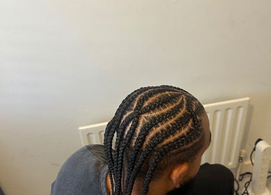 Intricate cornrow braids on a client at Braided By Ri, Gillingham, England, GB.