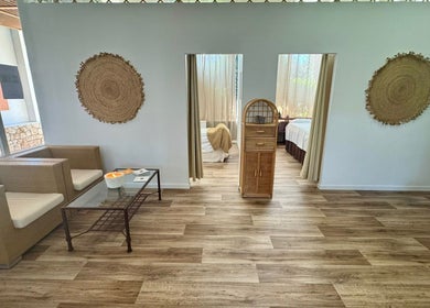 Relaxing lounge area at Earth&Sky, Sant Antoni De Portmany, Illes Balears, ES featuring cozy seating and decor.