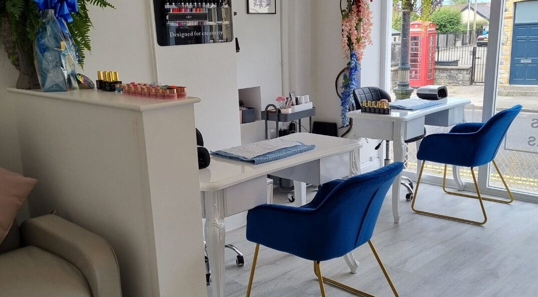 Elegant nail studio with plush blue chairs at Beauty Box Cowbridge, Cowbridge, Wales, GB.