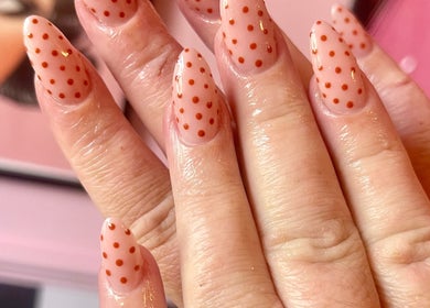 Stylish polka dot nail art at Nova Nails, Pontypridd, Wales, GB. Trendy and artistic manicure design.