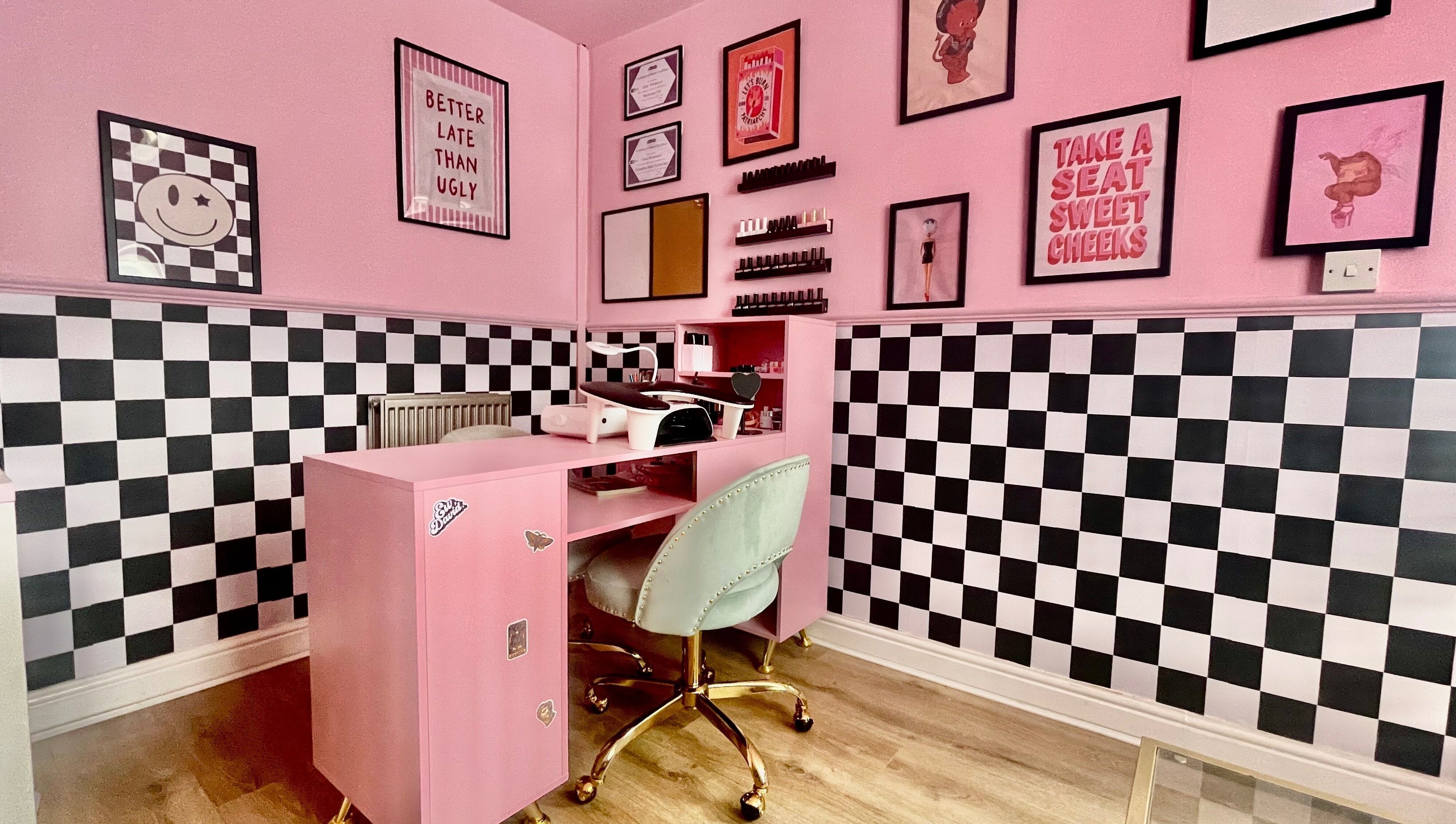 Nova Nails studio in Pontypridd, Wales, GB featuring stylish pink decor and checkered walls.