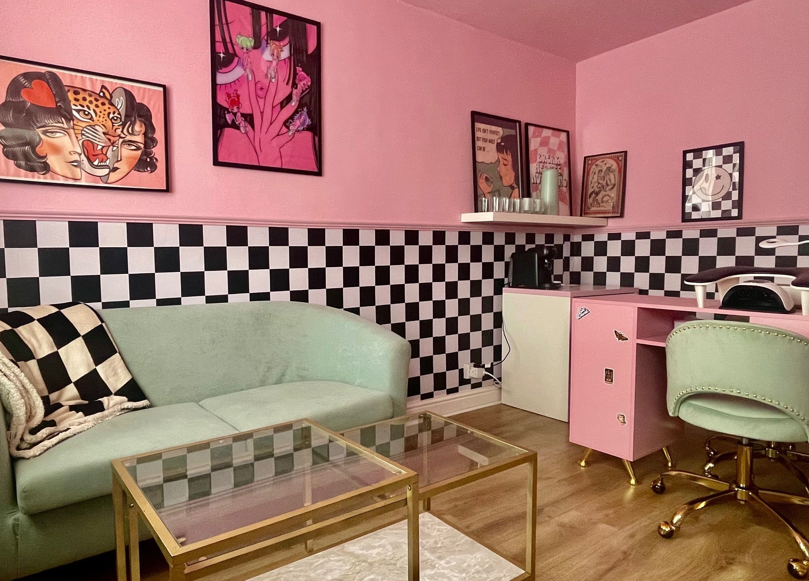 Nova Nails salon in Pontypridd, Wales, GB, featuring a chic pink decor with checkered accents and modern furnishings.