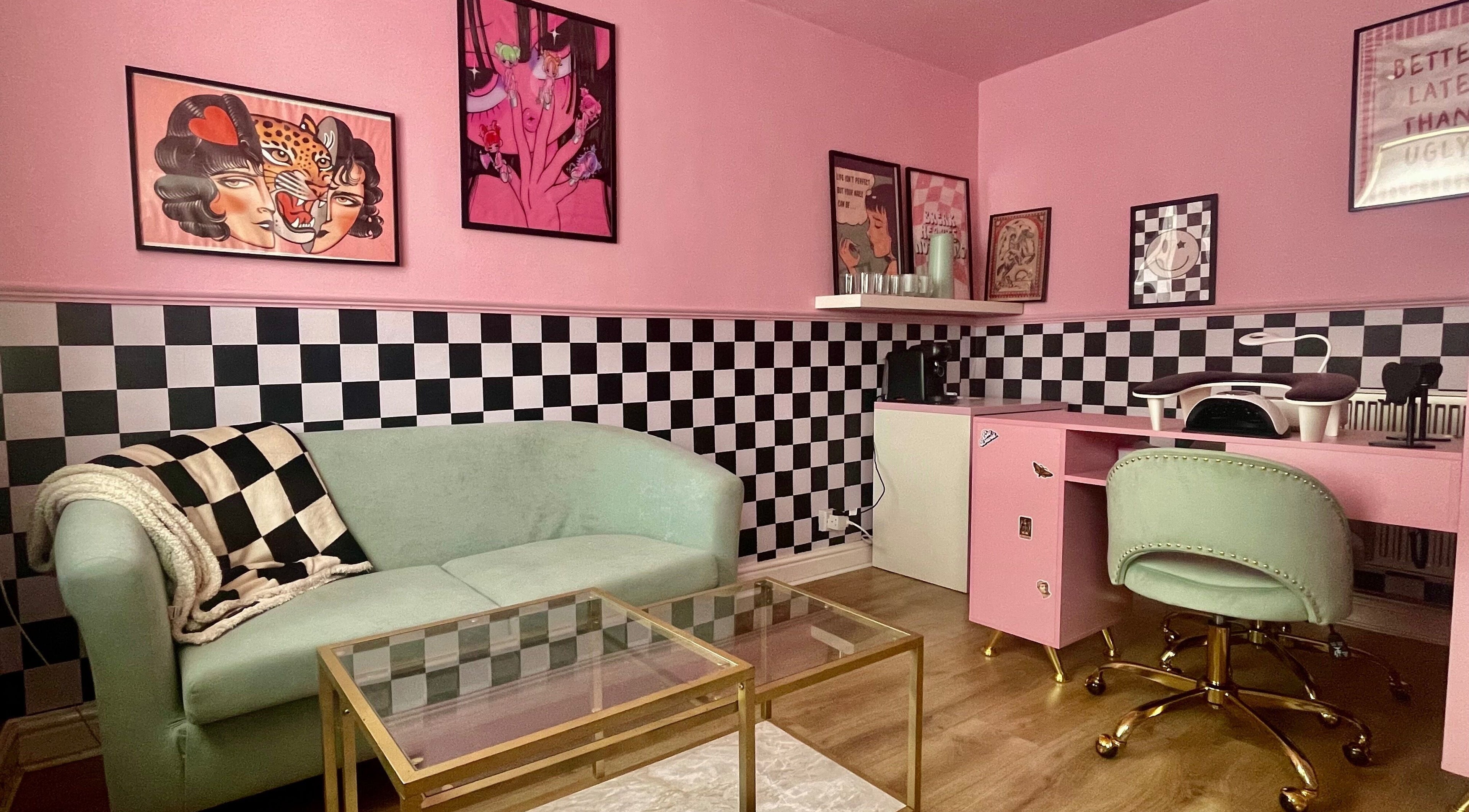 Nova Nails salon in Pontypridd, Wales, GB, featuring a chic pink decor with checkered accents and modern furnishings.