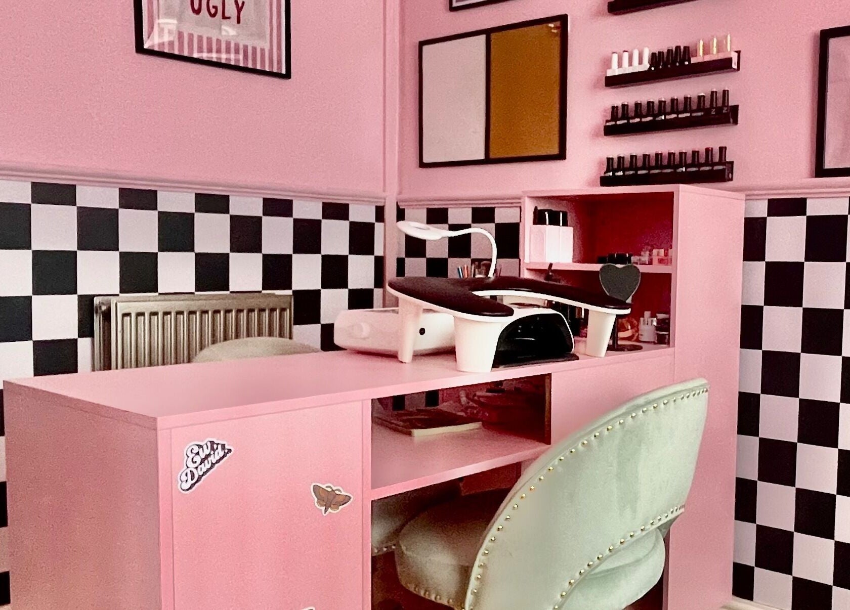 Stylish nail station at Nova Nails, Pontypridd, Wales, GB with pink decor and elegant setup.