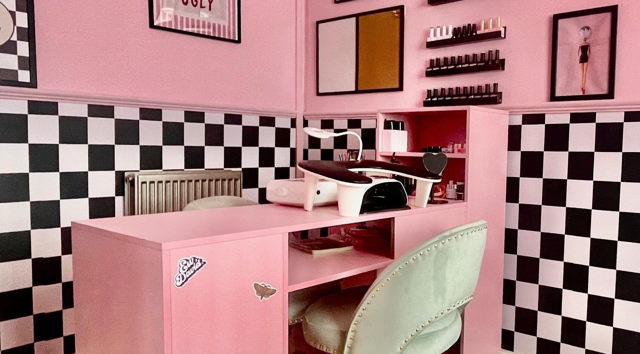 Stylish nail station at Nova Nails, Pontypridd, Wales, GB with pink decor and elegant setup.