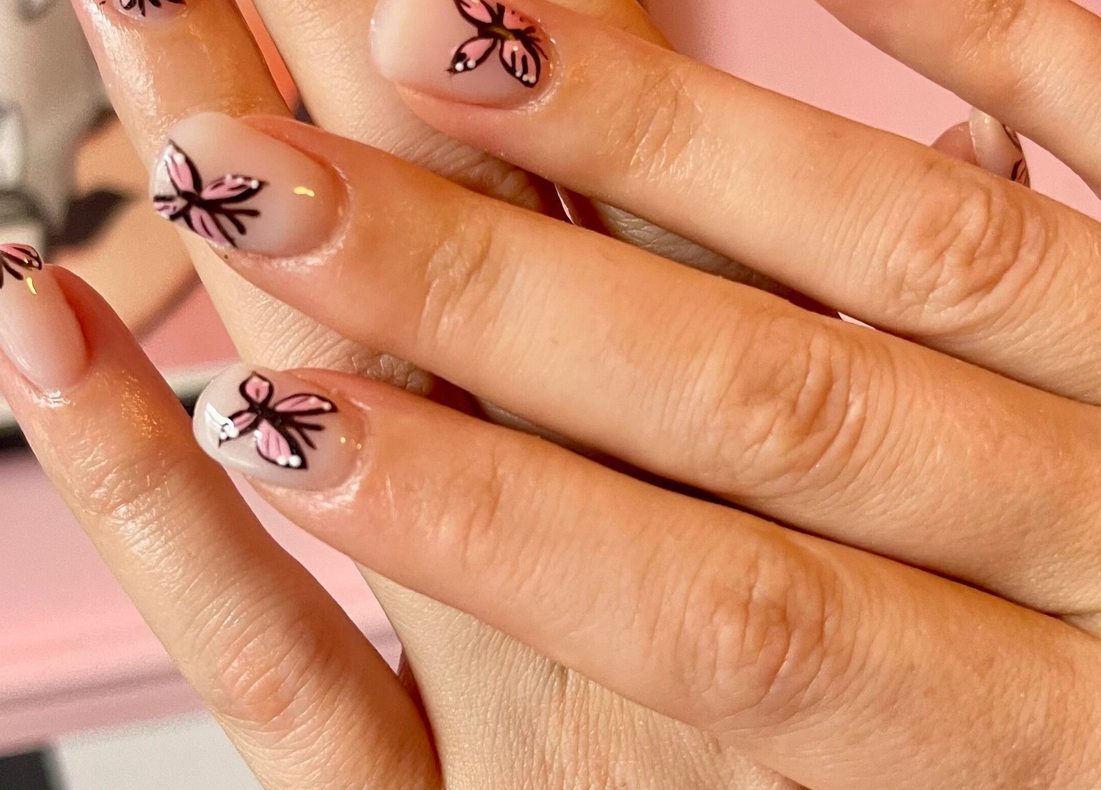 Beautiful butterfly nail art at Nova Nails, Pontypridd, Wales, GB, showcasing delicate designs and craftsmanship.
