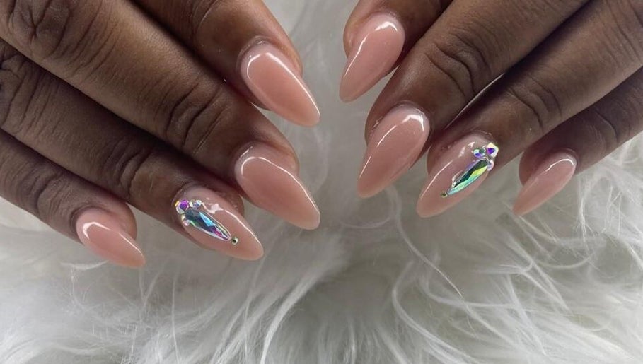 Elegant nude nails with gems at Maestra of Divine Nail Art Inc., Brighton, St. George, VC.