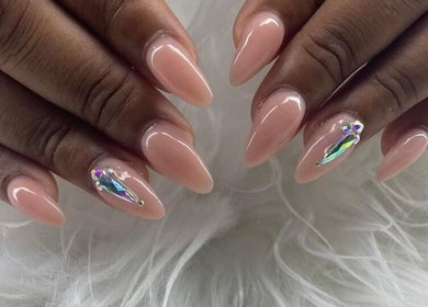 Elegant nude nails with gems at Maestra of Divine Nail Art Inc., Brighton, St. George, VC.