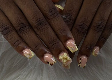 Intricate nail art at Maestra of Divine Nail Art Inc., Brighton, St. George, VC captured on a plush white background.