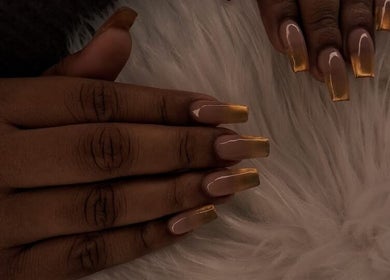 Stylish golden ombre nails at Maestra of Divine Nail Art Inc., Brighton, St. George, VC.