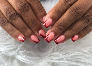 Stylish red-tipped nails at Maestra of Divine Nail Art Inc., Brighton, St. George, VC.