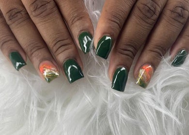 Stunning emerald nails with accent design at Maestra of Divine Nail Art Inc., Brighton, St. George, VC.