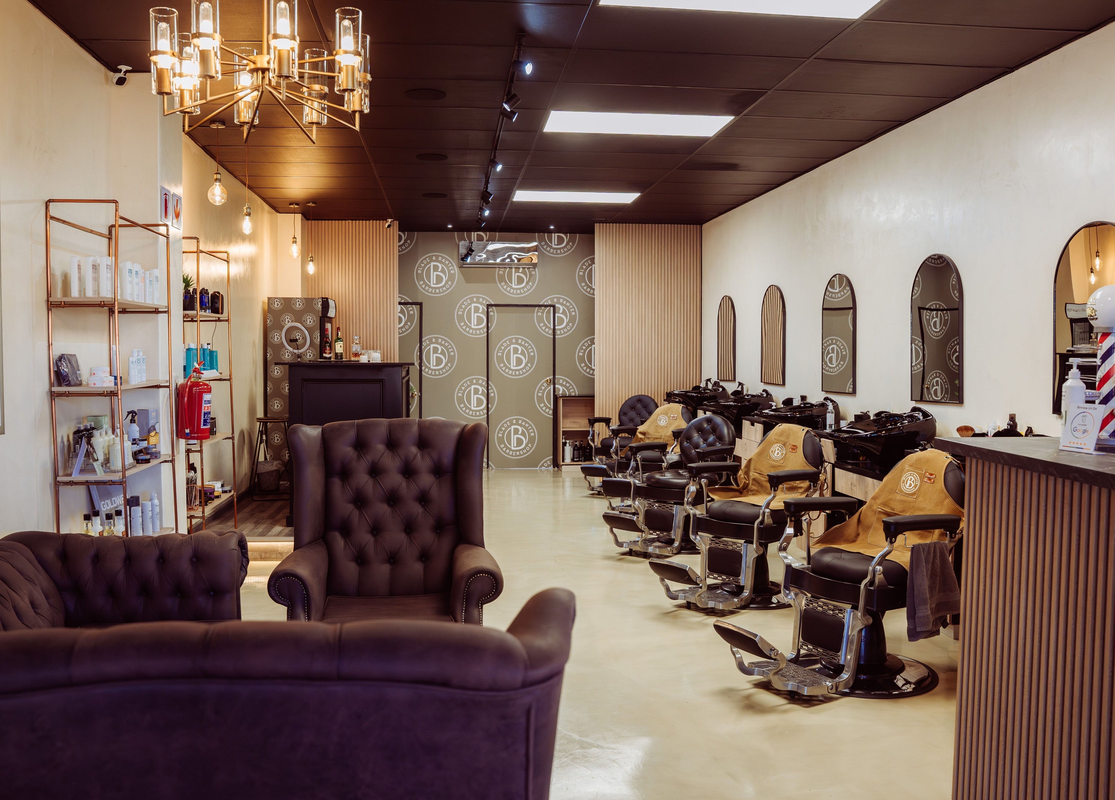 Elegant interior of Blade & Banter Barbershop in Midrand, Gauteng, ZA with stylish chairs and decor.