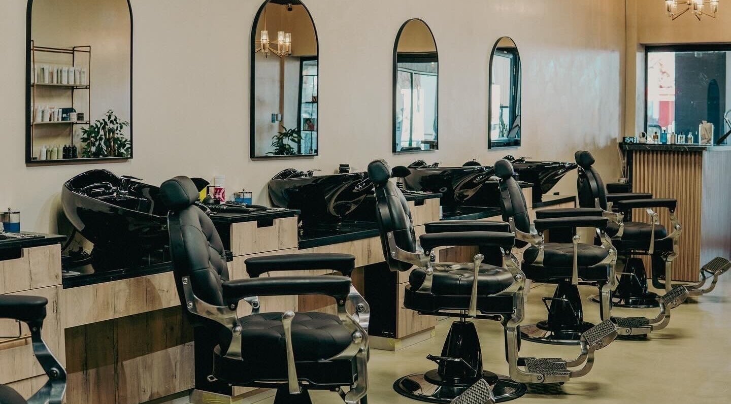 Modern barber chairs at Blade & Banter Barbershop, Midrand, Gauteng, ZA. Elegant salon setting.