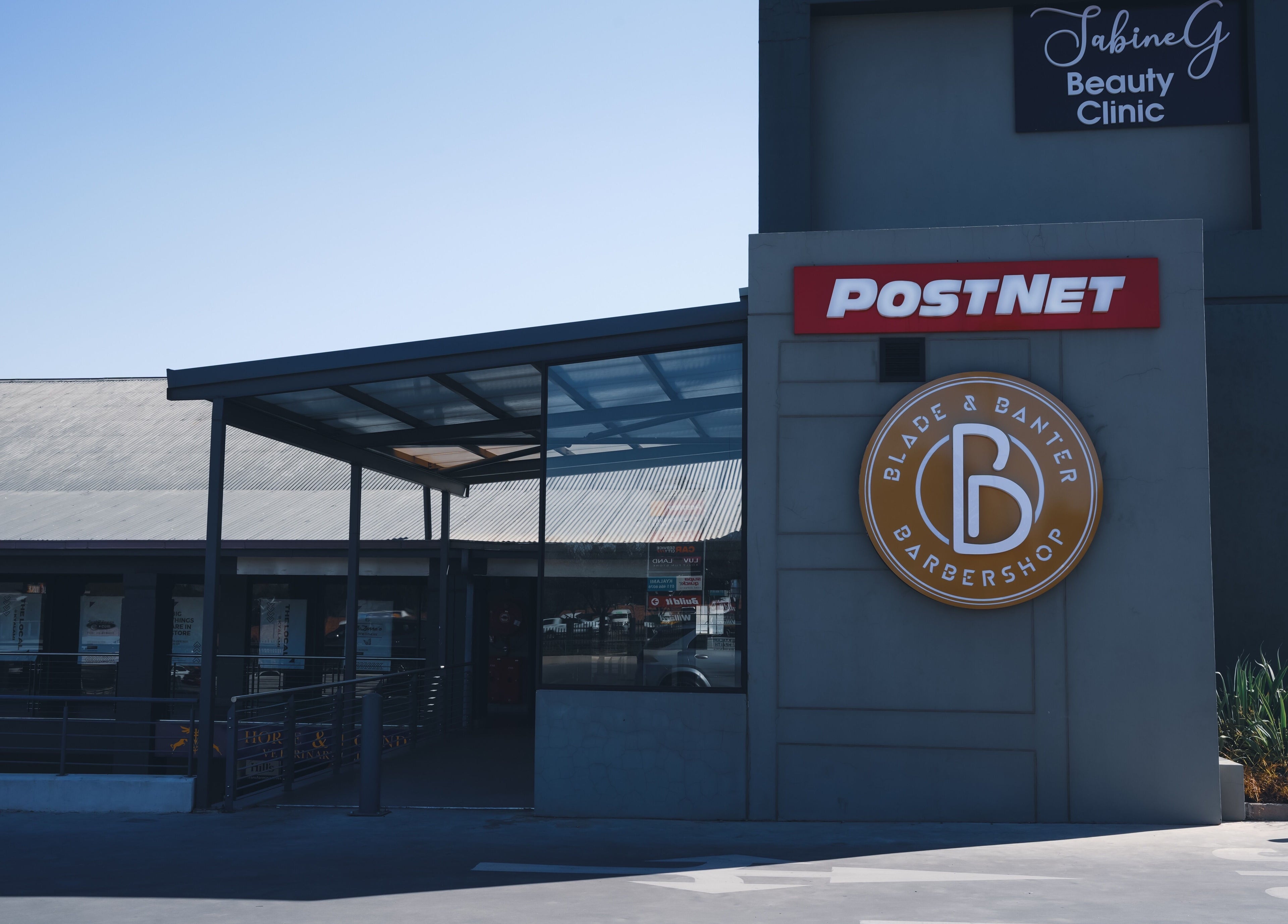 Front view of Blade & Banter Barbershop at Midrand, Gauteng, ZA, showcasing its modern signage.