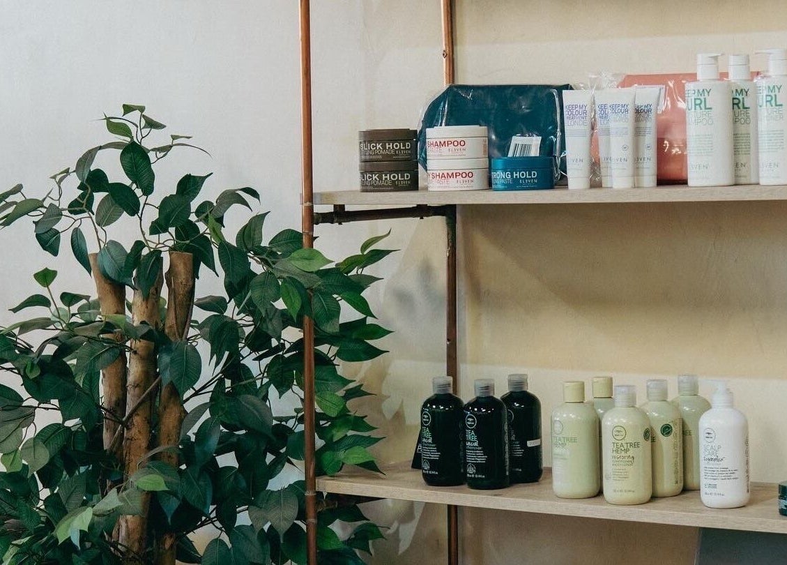 Stylish product shelf at Blade & Banter Barbershop, Midrand, Gauteng, ZA, featuring hair care essentials.