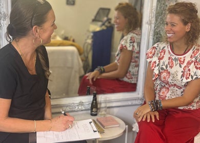 Consultation session at Found Skin, Mount Maunganui, Bay Of Plenty, NZ with smiling client and therapist.