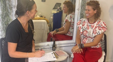 Consultation session at Found Skin, Mount Maunganui, Bay Of Plenty, NZ with smiling client and therapist.