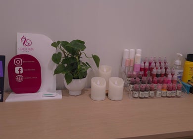 Beauty products and social media signs on a counter at Omni Skin Clinic, Brabham, Western Australia, AU.