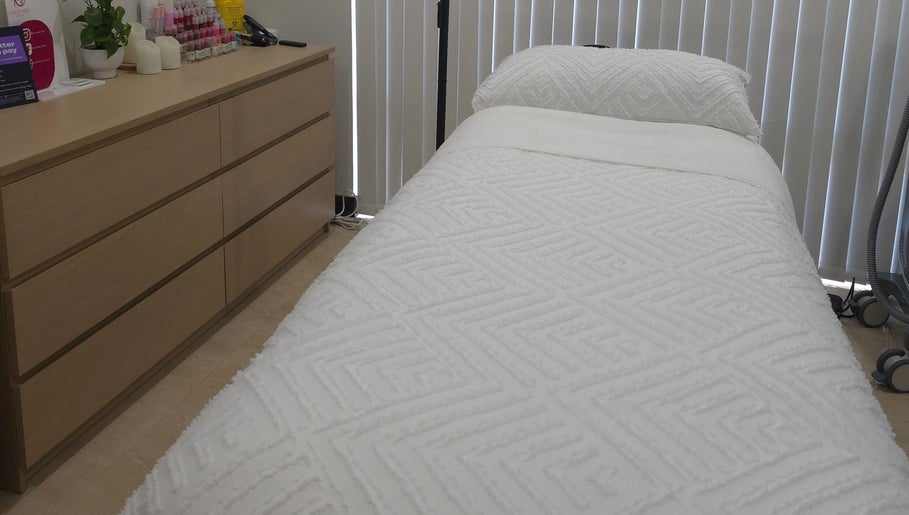 Relaxing treatment room at Omni Skin Clinic, Brabham, Western Australia, AU, featuring a plush spa bed.