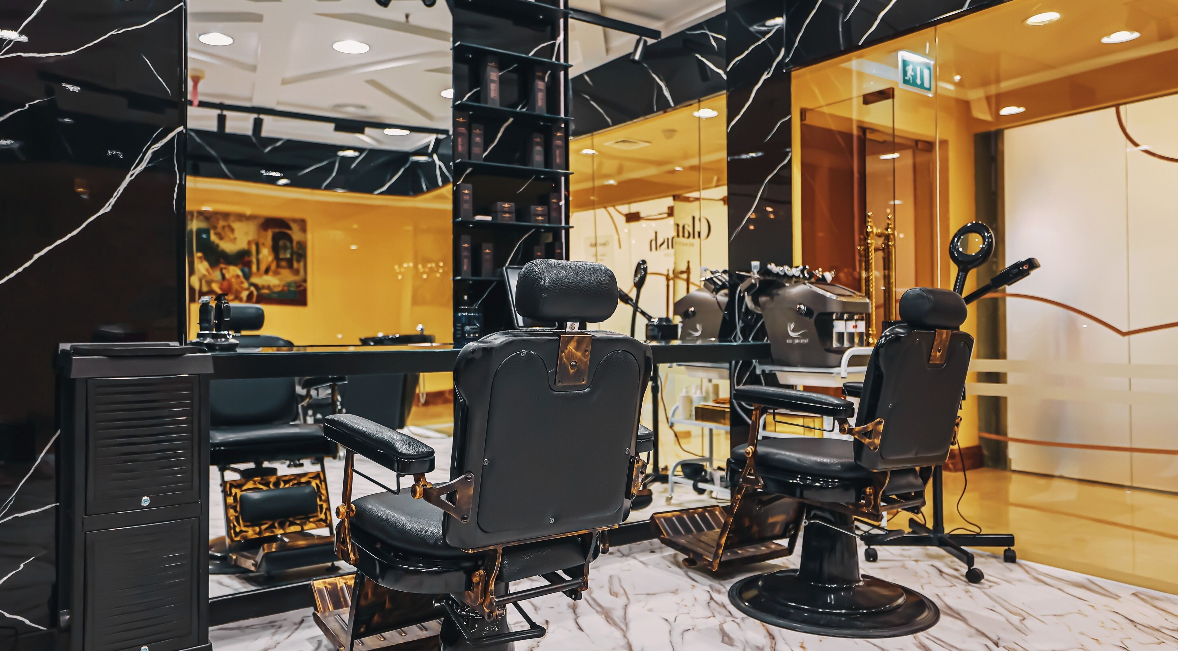 Elegant interior of The Jet Barber Gents Salon Palm Jumeirah in Dubai, AE featuring modern barber chairs and decor.