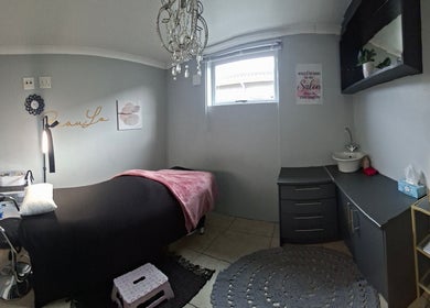 Elegant treatment room at BeauLo in Cape Town, Western Cape, ZA, featuring modern decor and soft lighting.