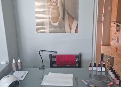 Nail care station at BeauLo in Cape Town, Western Cape, ZA, featuring nail tools and polish bottles.