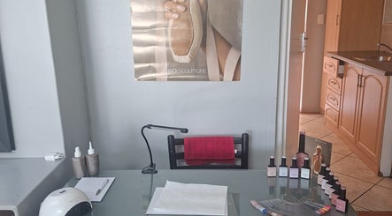 Nail care station at BeauLo in Cape Town, Western Cape, ZA, featuring nail tools and polish bottles.
